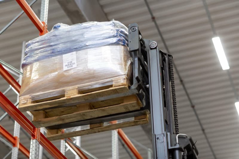 Equipment marked with PUWER guidelines in a warehouse
