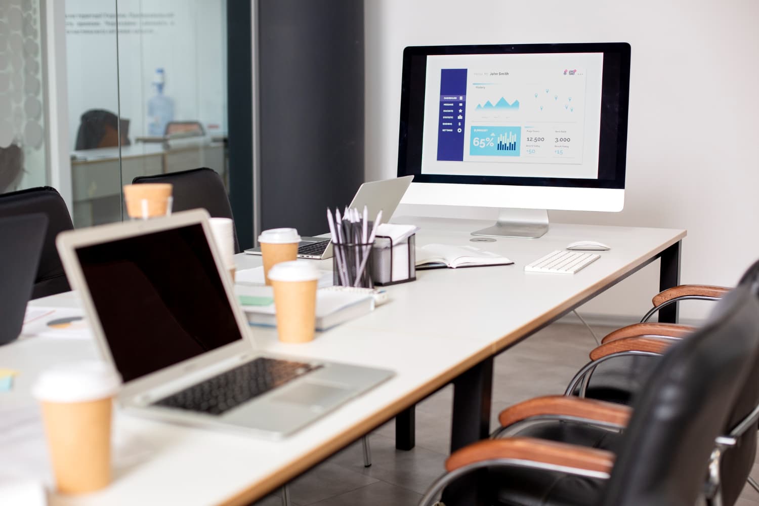 Laptop, servers, and office devices representing key assets in a hardware asset management system