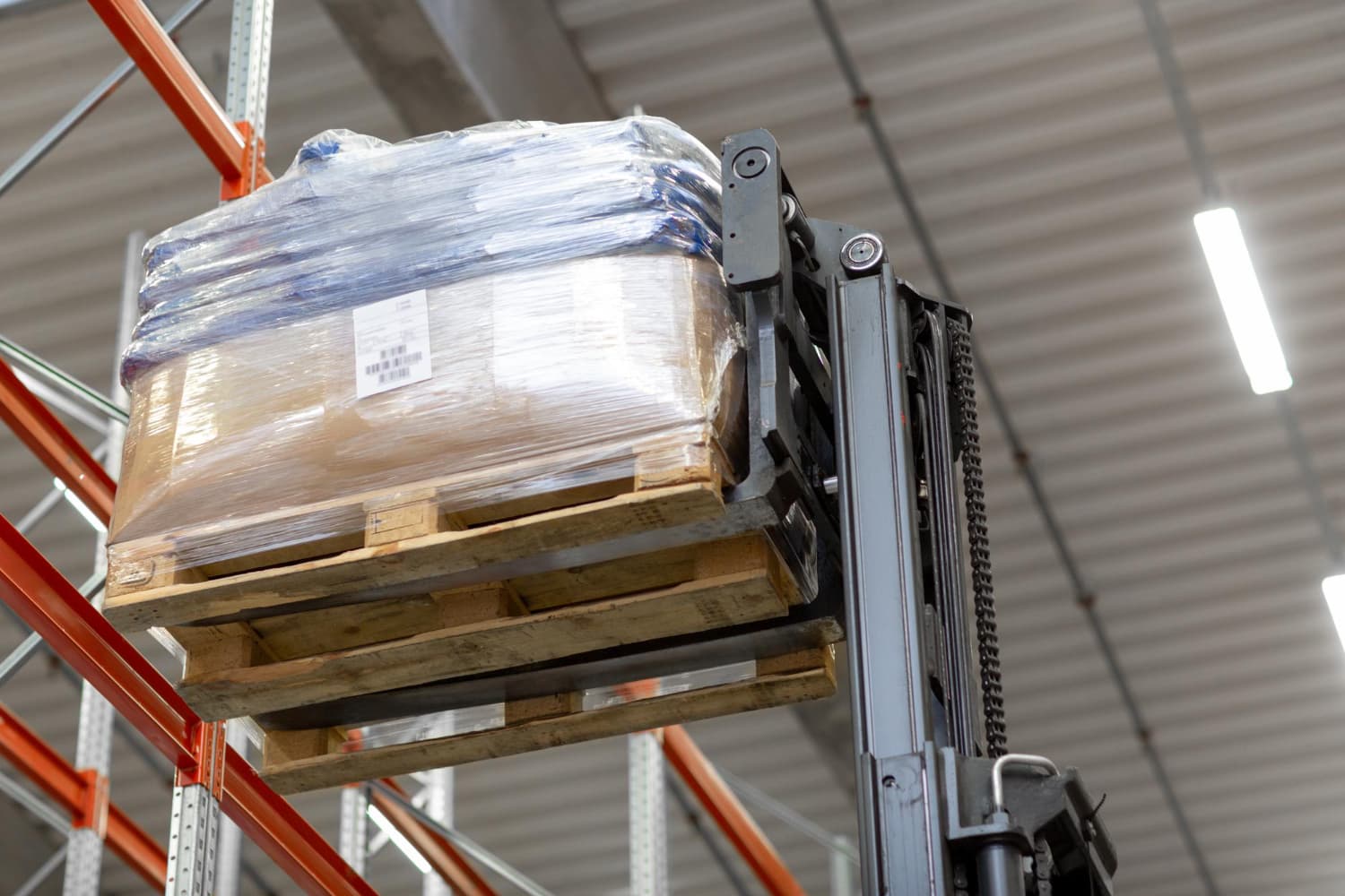 Equipment marked with PUWER guidelines in a warehouse